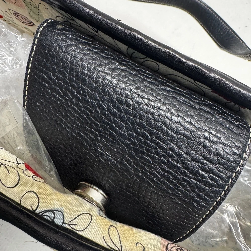 Brighton women’s straw handbag with charms, leather trim